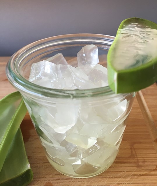 Fresh aloe vera fillets cut into cubes (250 g) in a glass