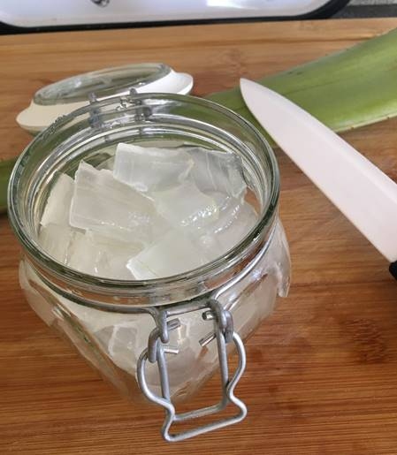 Fresh aloe vera fillets cut into cubes (300 g) in a glass